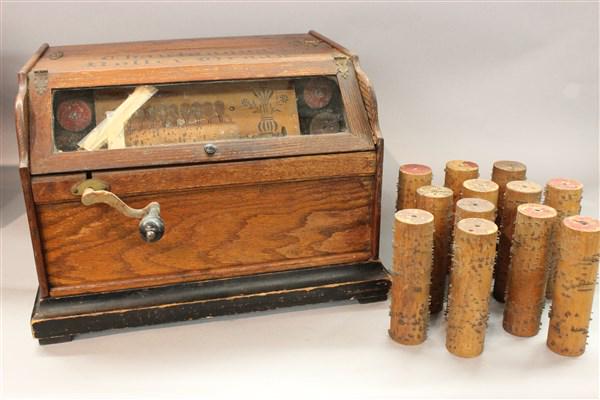 Chantaugua Roller Organ w/ Cylinder Player Rolls: A Chantaugua Roller Organ housed in wood case with extra cylinder rolls. Non-working. Dimensions: 12" X 17" X 14"