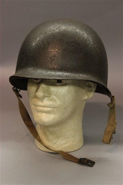 WWII American M1 Helmet w/ Liner: An American WWII M1 helmet with liner. Dimensions: 8" X 12 1/2" X 9"