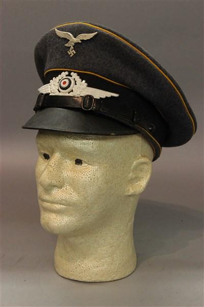 WWII German Paratrooper Hat: A WWII Enlisted German Paratrooper hat. Dimensions: 5" X 11" X 9 1/2"