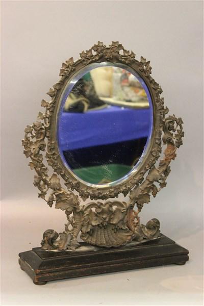 Victorian Shell Organic Form Mirror: A Victorian period cast iron organic form mirror with shell basin set on a wooden base. Dimensions: 20" X 15" X 4 1/2"