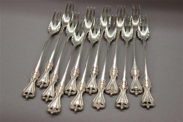 Twelve Sterling Silver Pickle Forks, Towle Old Colonial: Towle "Old Colonial" pattern set of Twelve (12) pickle forks. Pat. 1895 Dimensions: 6"L Total weight: 10.1 average ounces