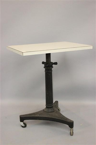 Adjustable Industrial Cast Iron Base Table: An adjustable typewriter table with cast iron base. Signed Karlo. Dimensions: 29" X 24" X 18"