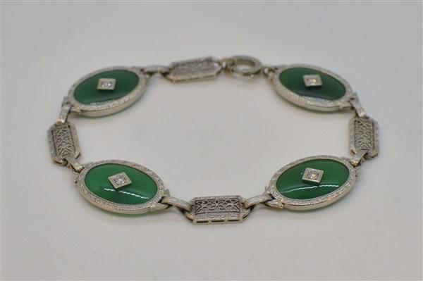 14k w.g. Green Jade And Diamond Filigree Bracelet: A fine vintage 14k white gold filigree bracelet with green jade stones and diamonds. Dimensions: 7"L and 1/2" h Total weight: 5.6 grams