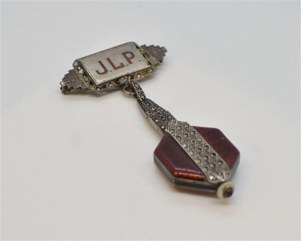 Vintage Art Deco Enameled Sterling Silver Watch Pin: An Art Deco enameled sterling silver watch pin pendant with marcasite stones. Monogrammed J.L.P. Dimensions: 3 1/4" X 1 1/2" Total weight: 1 avg. oz.