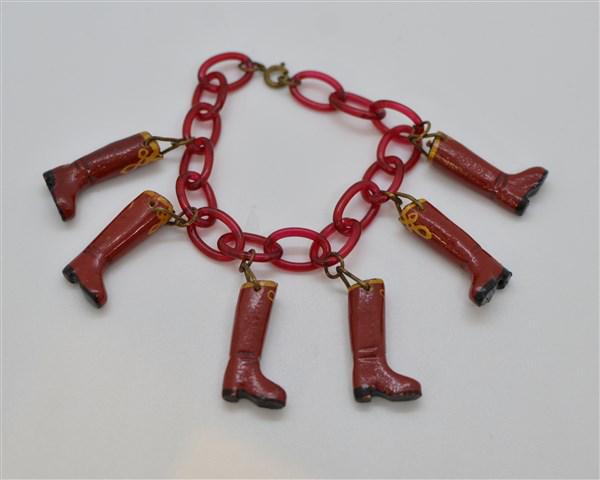 Vintage Plastic Boot Bracelet: A whimsical vintage plastic boot bracelet. Dimensions: 6" Length