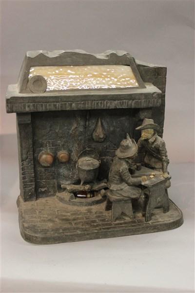 French Illuminating Fire Place Sculpture: A French illuminated fire place sculpture. A Teniers style seen with pheasants playing dice and fire lighted fire place in background. Marked reverse Made in Paris, France. Dimensions: 14 1/2"h X 14"L