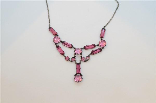 Vintage Pink Czech Glass Necklace: Vintage pink Czech glass necklace with sterling silver chain. Dimensions: 16" length