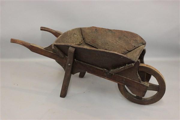 Old European Style Wheel Barrel: A old world European style wheel barrel. Dimensions: 22"h X 54"L X 22"d