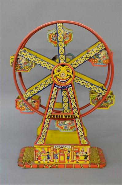 Chein Hercules Tin Toy Ferris Wheel: A Chein Hercules tin toy Ferris wheel. Made in USA Dimensions: 17 1/2" X 10 1/2" X 5"
