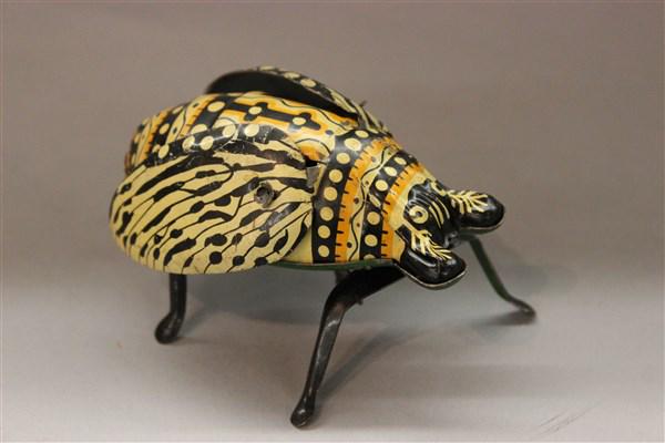 Made In Japan Windup Tin Toy Flying Beetle: Made in Japan windup tin toy flying beetle toy. Dimensions: 3" X 4" X 3"