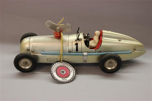 Vintage Marklin Toy Race Car: Vintage Marklin clock work toy race car with driver. Dimensions: 11"L