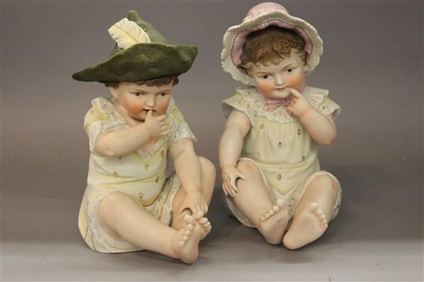 Victorian Large German Bisque Piano Babies: A pair of large Victorian German bisque piano babies. Dimensions: 11"h X 7"w