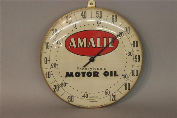 Amalie Pennsylvania Advertising Motor Oil Thermometer: Amalie Pennsylvania advertising motor oil sign thermometer. Dimensions: 10"d
