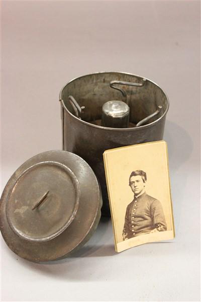 Civil War Soldier's Tin Lamp w/ CDV Card: A Civil War soldier's tin field lamp cannister with burner all complete. A CDV card inscribed "Yours Truly, Lt. Robert G. Anderson 1862.Dimensions: 5" X 5"