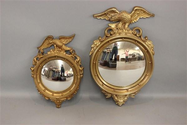Two Bulls Eye Eagle Mirrors: Two decorative Syrocco Wood Bulls Eye Mirrors with eagles. Dimensions: 29" X 18" and 21" X 15"