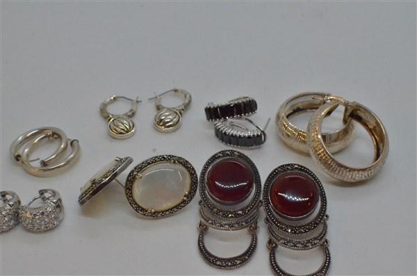 Estate Sterling Silver Earring Lot: A compiled grouping of estate sterling silver earrings. eight pairs in total with evening ware, basic hoops and marcasite. Total weight: 1.43 troy ounces