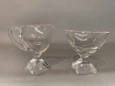 Orrefors Crystal Sugar And Creamer: A pair of Orrefors hand signed pedestal sugar and creamer. Dimensions: 4” h Excellent.