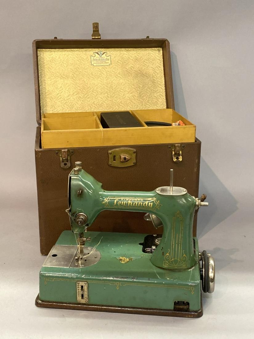 Vintage Green Enamel Sewhandy Sewing Machine: Vintage Standard Sewhandy Sewing Machine By General Electric. Green enamel with case, directions, attachments etc. Dimensions: 9.5” x 12” x 7”