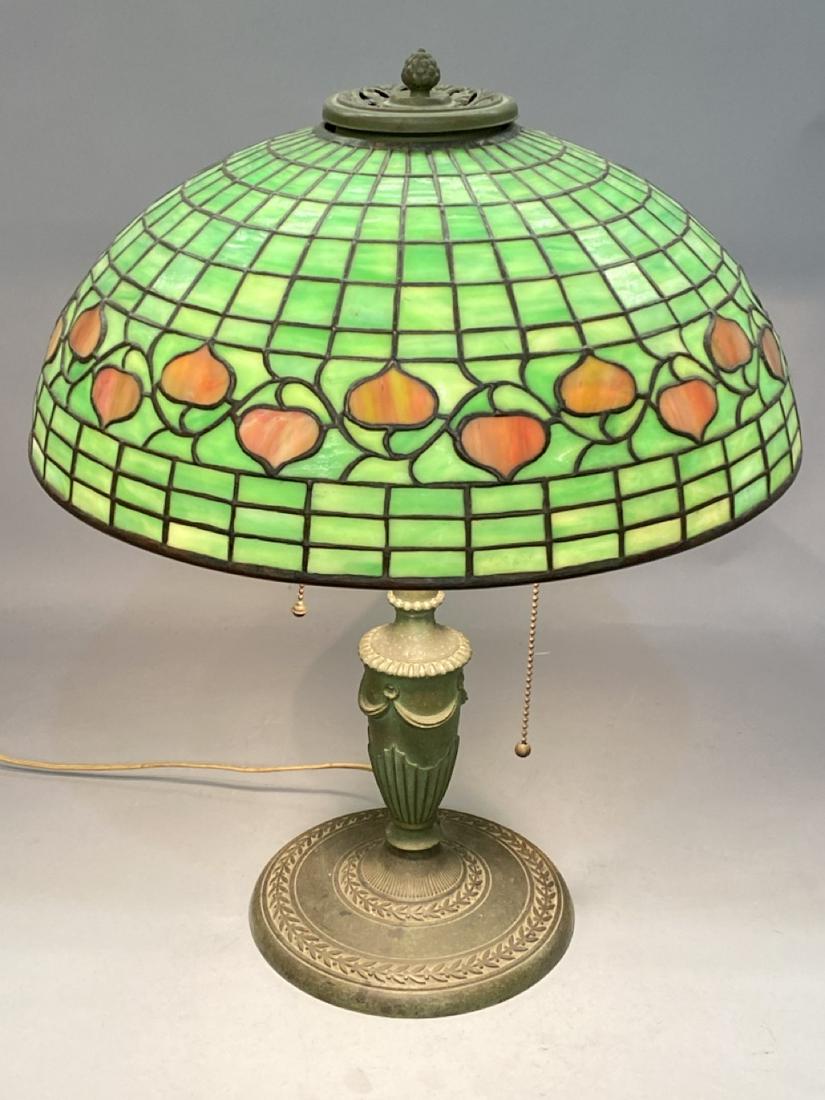 Tiffany Studios Acorn 1435 Lamp Shade: A Tiffany Studios Acorn 1435 green table lamp shade set on a incorrect base by Bradley & Hubbard. Shade marked Tiffany Studios 1435. Dimensions: Shade measures 6 1/2"h and 16" diameter.Provenance: Fou