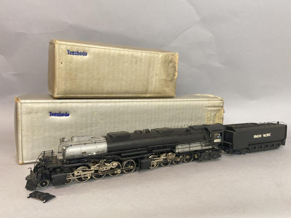 Tenshodo HO Scale 4002 Union Pacific Brass Locomotive: Tenshodo painted brass big boy HO scale 4002 union pacific locomotive engine and tender. Boxes have water damage one piece detached, some of the coal is flaking off