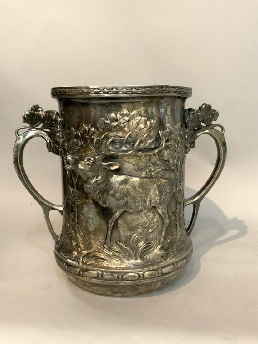 Victorian High Relief Double Handled Tankard, Hunt: Victorian High Relief Double Handled Tankard. Silver plated with protruding moose in woods decorated on both sides. No markings found. Dimensions: 10"h X 13"d