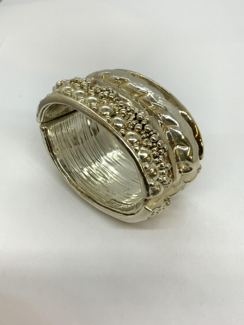 Designer "Brian" Sterling Silver Brutalist Bracelet: Designer Brian signed brutalist style clamper bracelet. Dimensions: 3" X 2" Total weight: 2.25 troy ounces