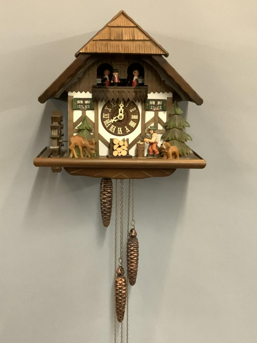 Adolf Herr German Cuckoo Clock: Adolf Herr German Cuckoo Clock. Signed with Reuge musical movement (Edelweiss) Made in Schwarzwalk, Germany Dimensions: 13 1/2" X 13" X 8" Missing pendulum and small knick to left side of roof corner.