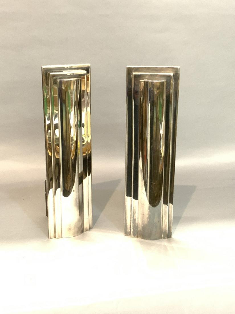 Art Deco Andirons: Art Deco polished chrome plated steel andirons. True to period c.1930. Unsigned. Dimensions: 10 1/2" X 4" X 5"