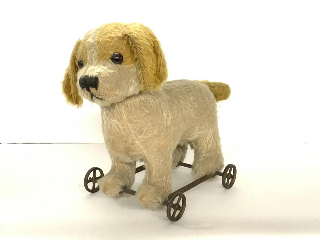 Straw Stuffed Puppy Dog Pull Toy: An antique straw stuffed puppy pull toy. Dimensions: 10" X 11" X 6"