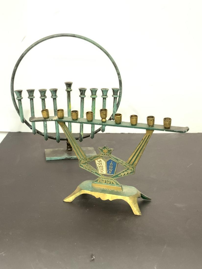 Israeil Menorah Group: Two vintage Mid Century iron Menorahs. Israel. One signed Karshi. Dimensions: 10" X 9"