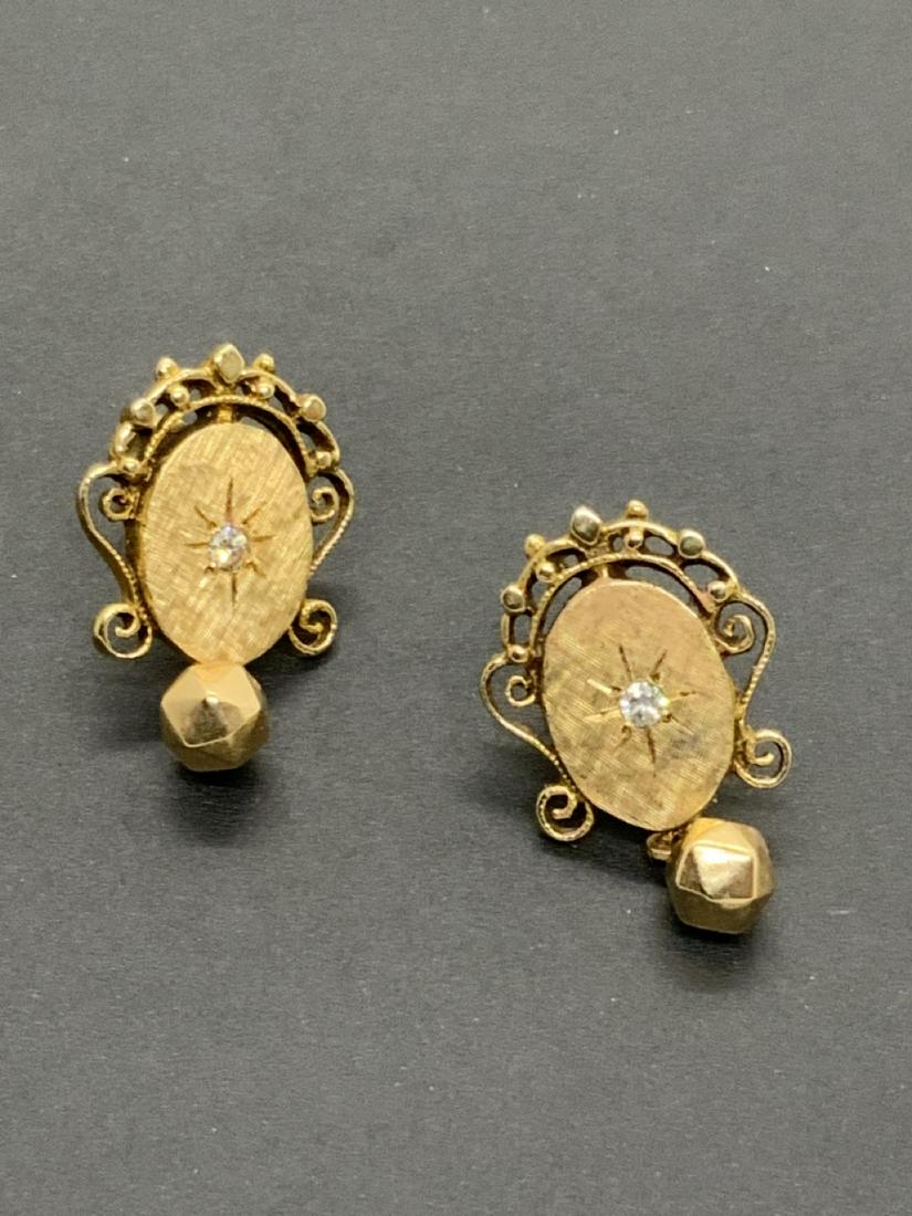 14k y.g. Edwardian Style Diamond Earrings: 14k yellow gold Edwardian style diamond earrings. Pierced. Dimensions: 1 1/4" X 1/2" Total weight: 6.6 grams Marked 14k