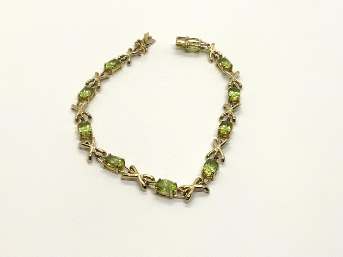 14k y.g. Peridot Bracelet: 14k yellow gold peridot bracelet. 7" length Total weight: 6.2 grams