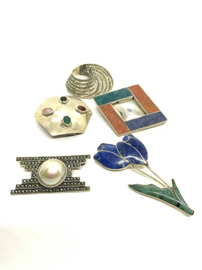 Five (5) Sterling Silver Pins: Five assorted sterling silver pins with multi gemstones, Judith Jack marcasite etc.