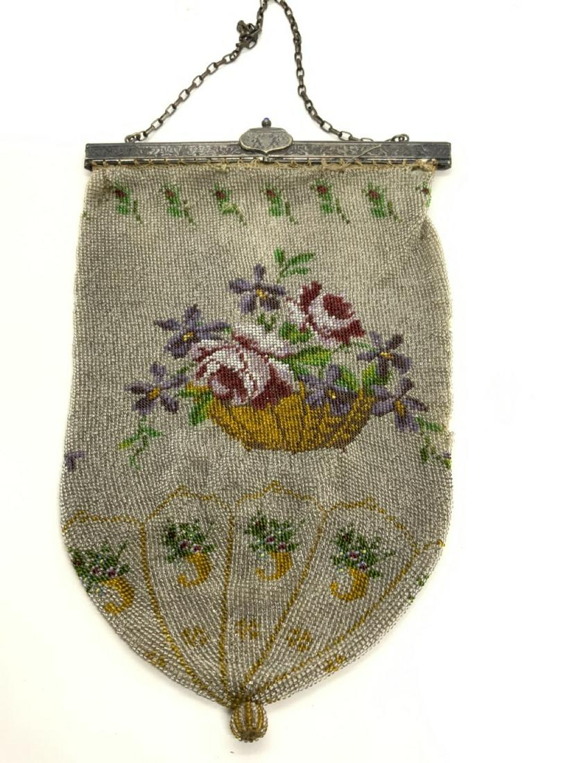 Victorian Beaded Purse: Victorian fancy beaded purse with flowers in basket pattern. A fine silver plated frame with blue sapphire cabochon style stones. Dimensions: 10"h X 6 3/4"w and 17" height including chain. Siome repai