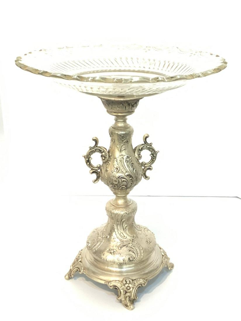 875 European Silver Monumental Compote: Prominent large serving compote. 875 silver German. Marked with half moon and crown mark. Early 20th century. Inscribed in German and dated 1901. Dimensions: 17"h X 13 1/2" dTotal weight: 36.4 average