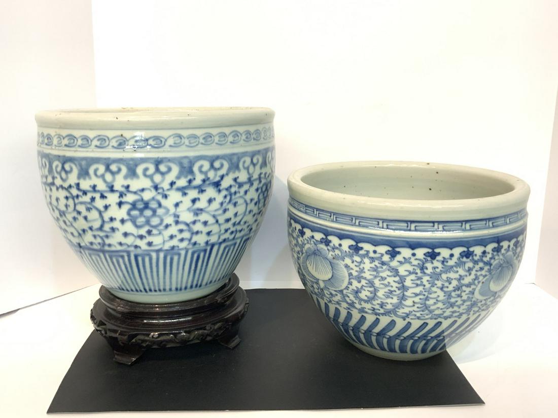 Two (2) Chinese Blue & White Bowls: Two (2) decorative Chinese blue and white jardinaires. Dimensions: 7 1/2"h X 10"w