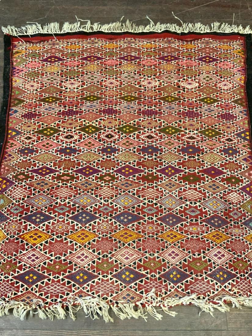 Tribal Throw Rug 3ft 6â€ x 3ft: Tribal throw rug. Dimensions: 3ft 6" X 3ft Provenance: Riverdale Bronx Estate, most rugs acquired on travels in Turkey and Mid East.