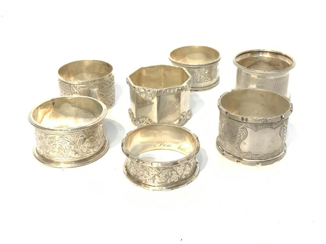 Seven (7) English Sterling Silver Hallmarked Napkin: Seven Victorian English Sterling Silver Napkin Rings. Markings for London and Birmingham. As seen in photograph preview. Total weight: 6.05 Troy ounces