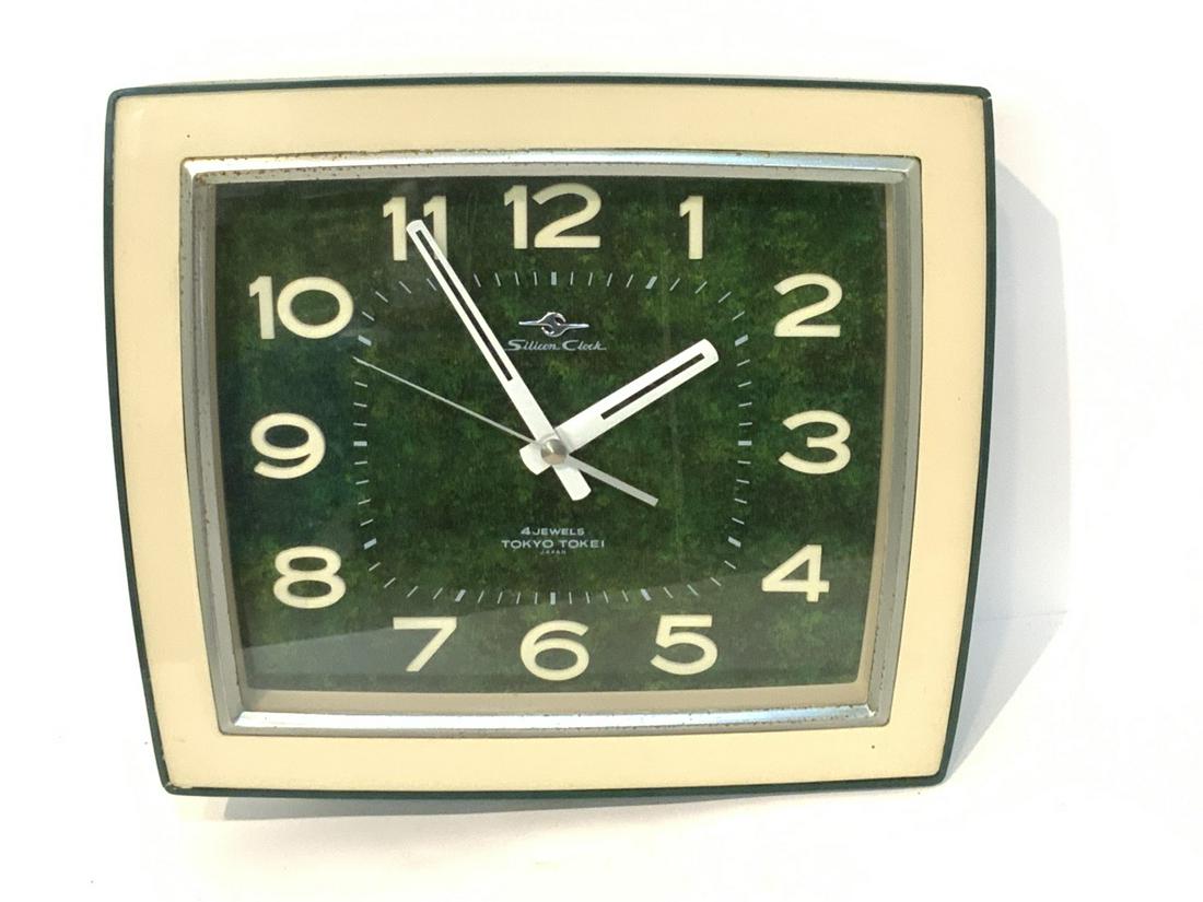 1960's Japanese Modern Wall Clock: Vintage 1960's Tokyo Tokei 4 jewel Silicon wall clock. Dimensions: 12" X 14"Some pitting to metal trim noted. Clock is in working order. Please see photograph preview or call.