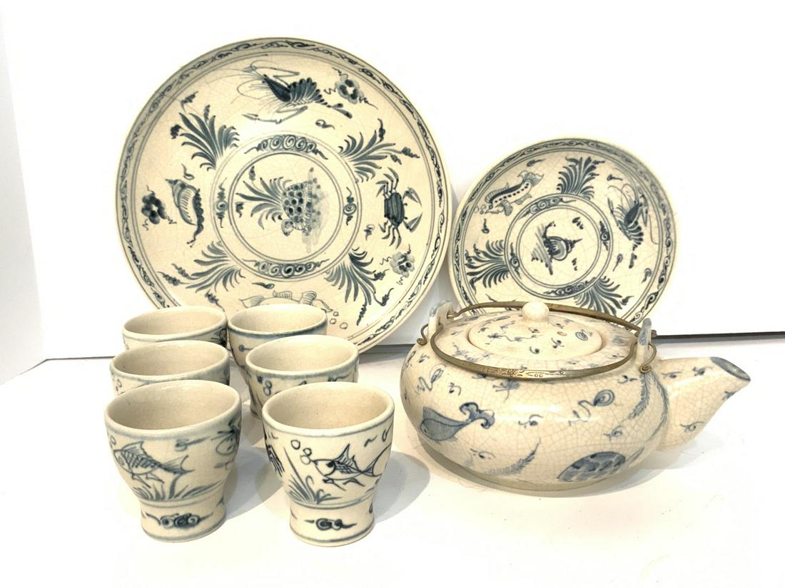 Blue And White Korean Porcelain Tea Set: Blue and white porcelain teapot, six cups and two dishes 7" and 9 1/2' diameter. Probably Korean