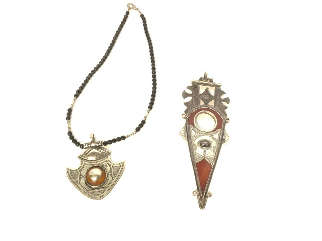 Tuareg African Silver Jewelry: Tuareg carnelian spear silver pendant and necklace with pendant. Dimensions: 6" X 2" largest pendant.