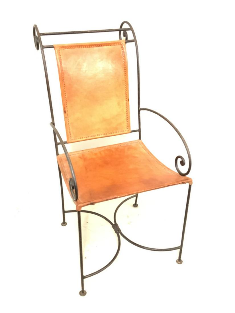 Vintage Stitched Leather And Wrought Iron Arm Chair: A stitched leather and hand wrought iron arm chair. Dimensions: 39"h X 17"