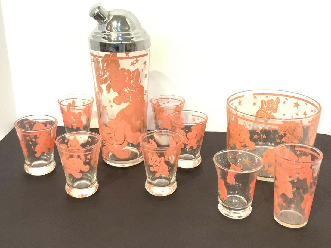 Art Deco Pink Elephant Glass Barware: Art Deco pink elephant cocktail shaker set, ice bucket, six glass and two single glasses. A fun set with happy lucky pink elephants. Dimensions: 10 3/4" X 4" (shaker), 5 1/2" X 4" (bucket)