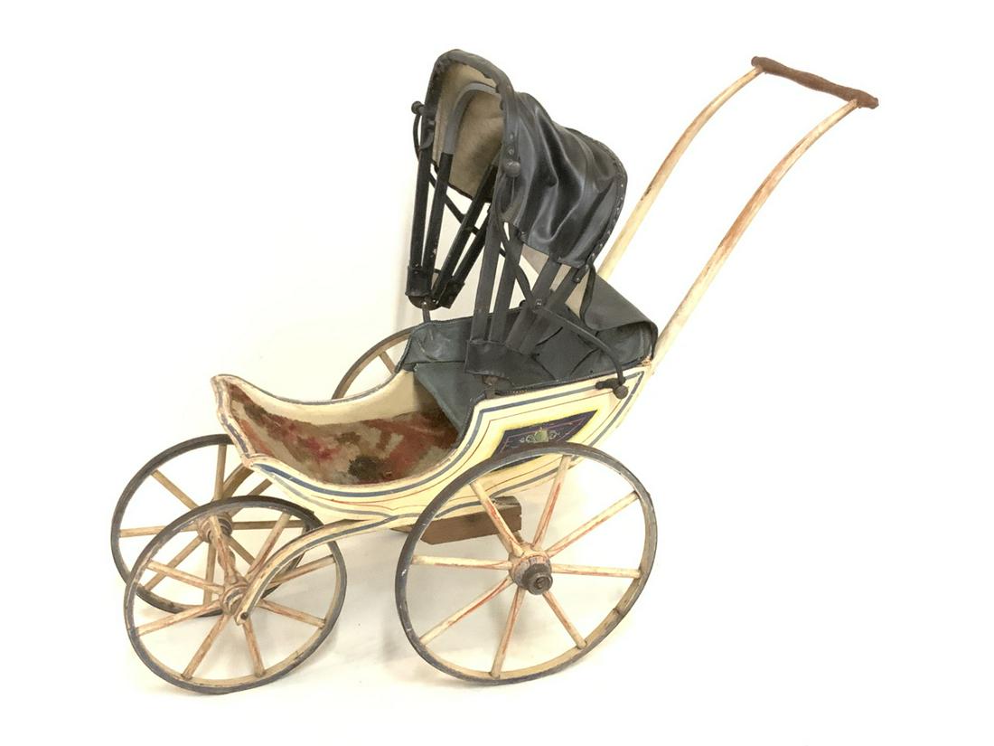 Antique 19th c. Fancy Doll Carriage: A fancy 19th century doll carriage with red, white and blue paint. Upholstered seating. Dimensions: 28" X 33" X 16"