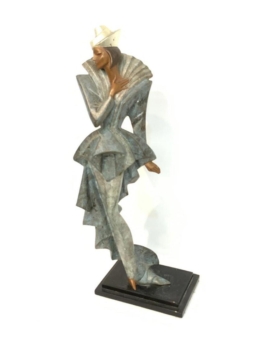 Art Deco Style Bronze Female Statue: Art Deco Style Bronze Sculpture In The Style Of Erte. Signed by Daner Austin Sculptures c.1991 257/750 Dimensions: 17" X 5 3/4"