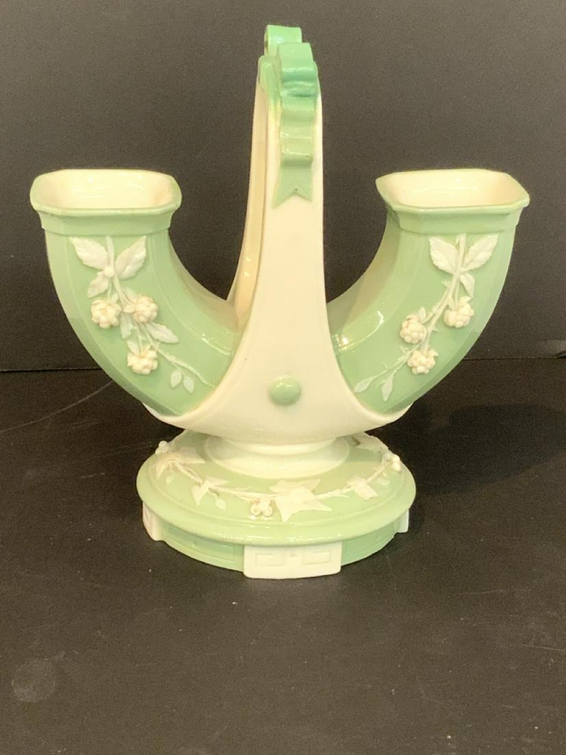 Minton Porcelain Double Basket Vase: Minton double basket vase. Celadon green and cream white coloring. Small hairline noted. Please see photograph preview or call. Dimensions: 6 3/54"h X 4"