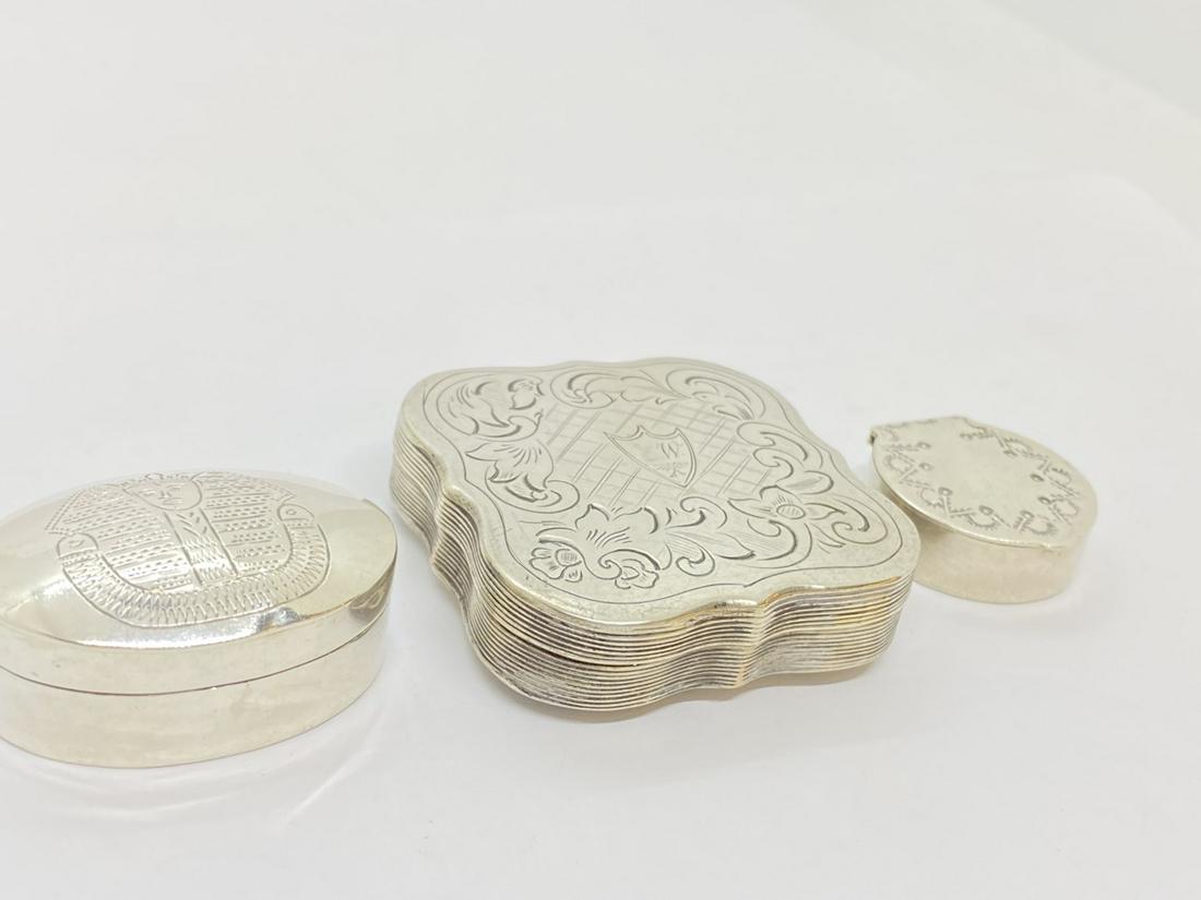 Three (3) Sterling Silver Pill Boxes: Three (3) sterling silver pill boxes.Total weight: 1.69 ozt