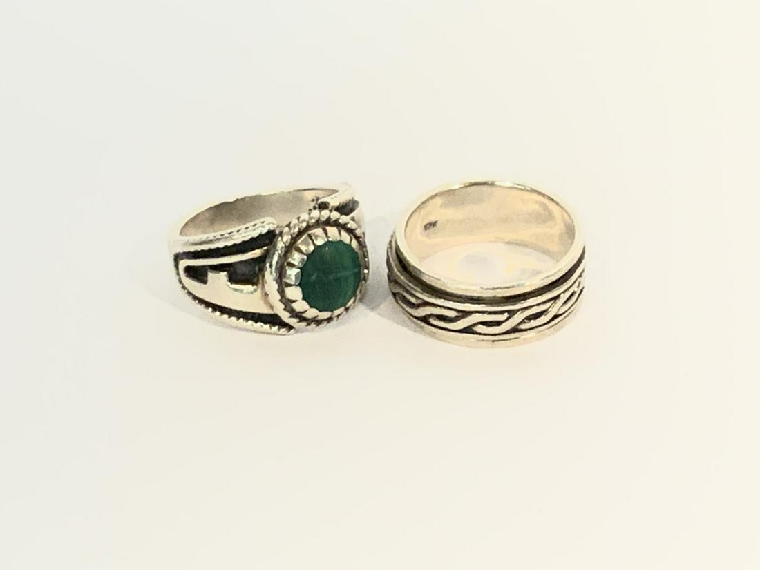 Two (2) Men's Sterling Silver Rings: Two (2) Heavy men's sterling silver rings. One with malachite stone. Size 10.Total weight: 21.01 grams