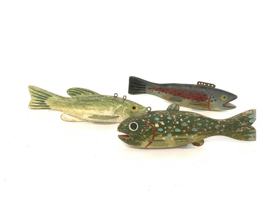 Three (3) Vintage Wood Fish Decoys: Three (3) vintage/antique wooden fish decoys Wood with metal and lead weighted. Dimensions: 2 1/2"h X 7" approx.