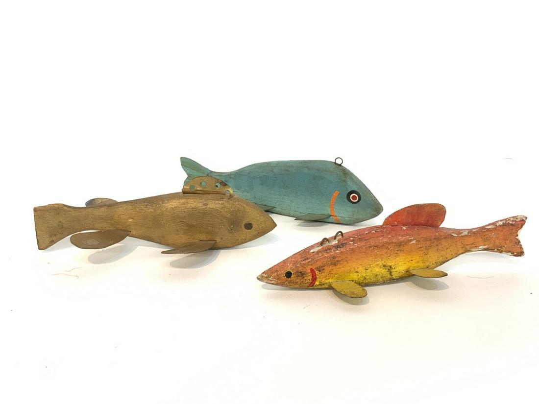 Three (3) Antique Wood Fish Decoys: Three (3) Piece vintage wood, metal and lead weighted fish decoys. Dimensions: 2 1/4" X 7"